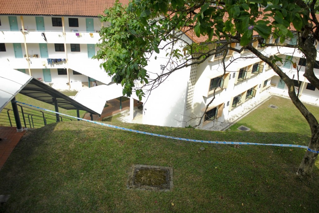 The 23-year-old man, who had visited his ex-girlfriend at her third-floor room at Hall of Residence 1's Block 15 this afternoon, was found on a grassy patch with minor injuries. PHOTO: YEO KAI WEN