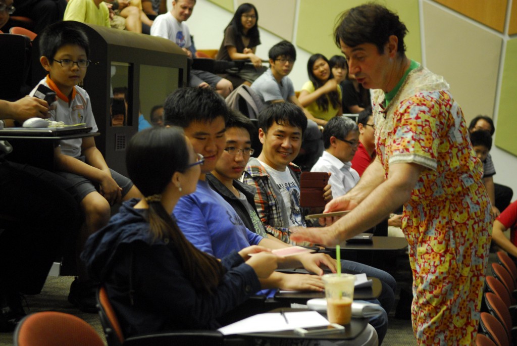 UP CLOSE AND PERSONAL: A member of the audience being treated to a card game. PHOTO: VIMALA D/O GANAVALU