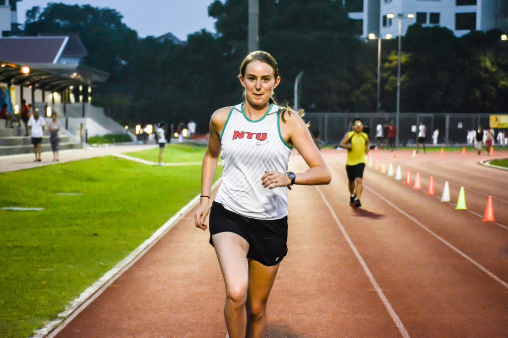 WARMING UP: Emily Willson, 21, trains on the tracks at NTU’s (SRC) in the evenings. The cross-country athlete from Colorado trains only at dusk due to Singapore’s warmer climate.