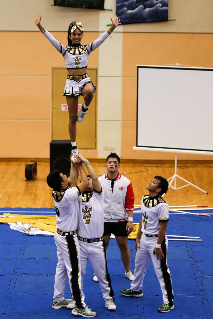 LIBERTY TO SHINE: Hall 7, performing as Cleopatra, executes their assisted partner stunt with grace and poise.  PHOTO: Matthew Chew