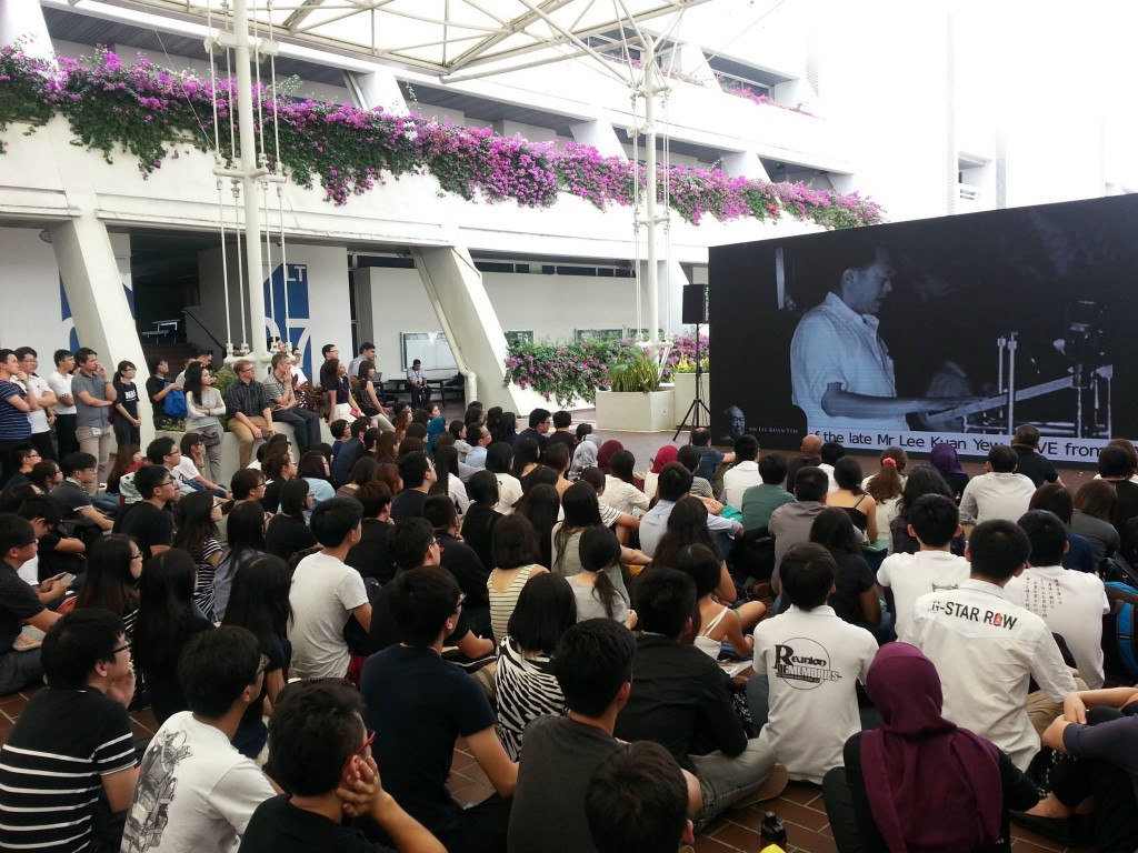 OVERWHELMING RESPONSE: The ceremony was screened outside Tan Chin Lecture Theatre, with people who were unable to enter the auditorium watching the ceremony from the live broadcast there instead. PHOTO: NTU