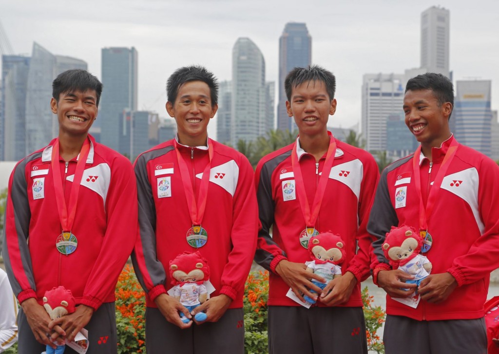 SUPER SILVER: Syahir (first from left) attributed his silver medal to the team’s hard work.