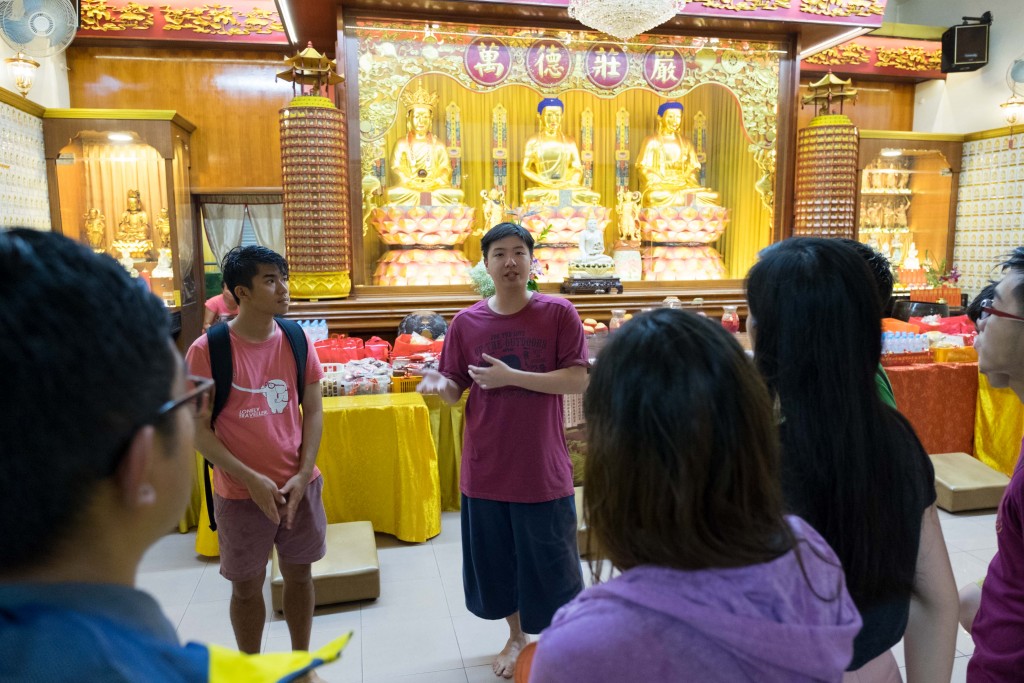 Chong shares about the history of the century-old temple during a heritage tour by Geylang Adventures.