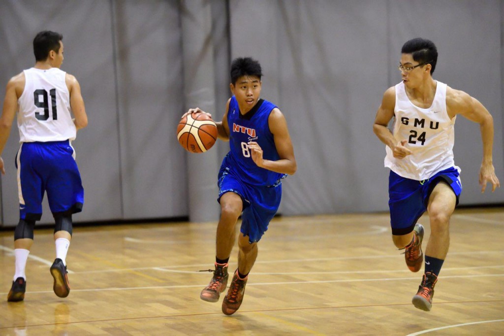 BREAKING THE DUCK: NTU’s Kan Wei Huat dribbles past a Singapore Management University opponent en route to their first title in four years. PHOTO: WONG FOO LAM