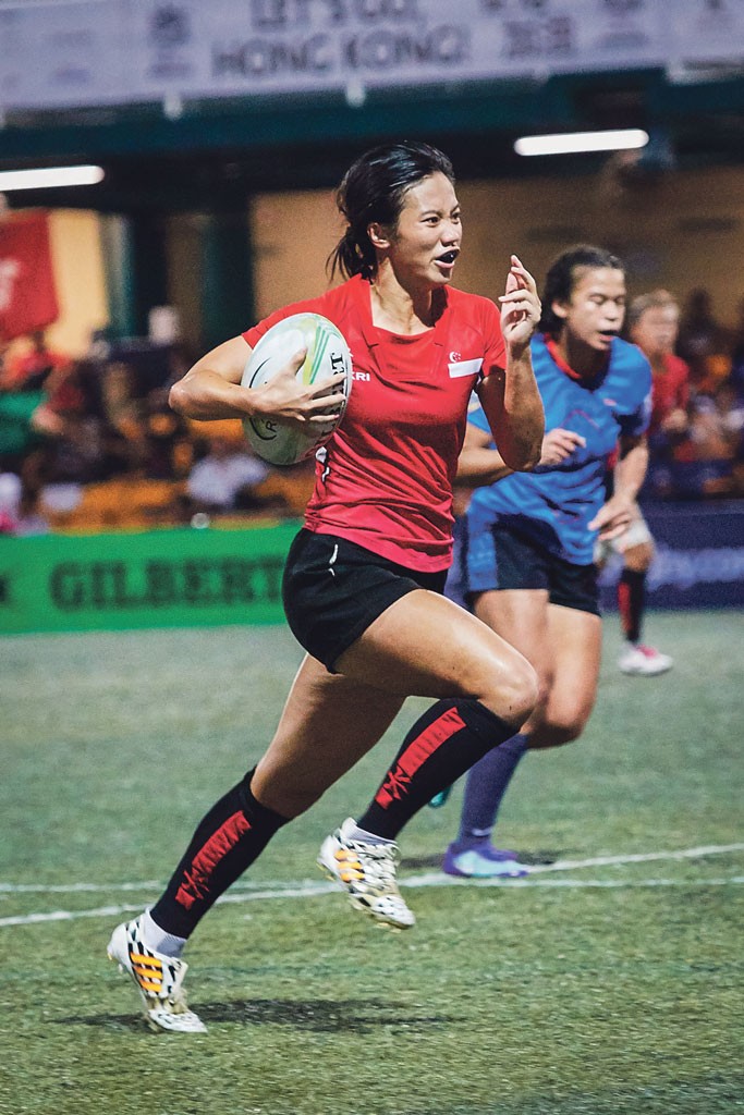 Ong Pei Yi (in red), 23, does not shy away from any rugby challenge in her way. PHOTO: GOZAR IMAGES