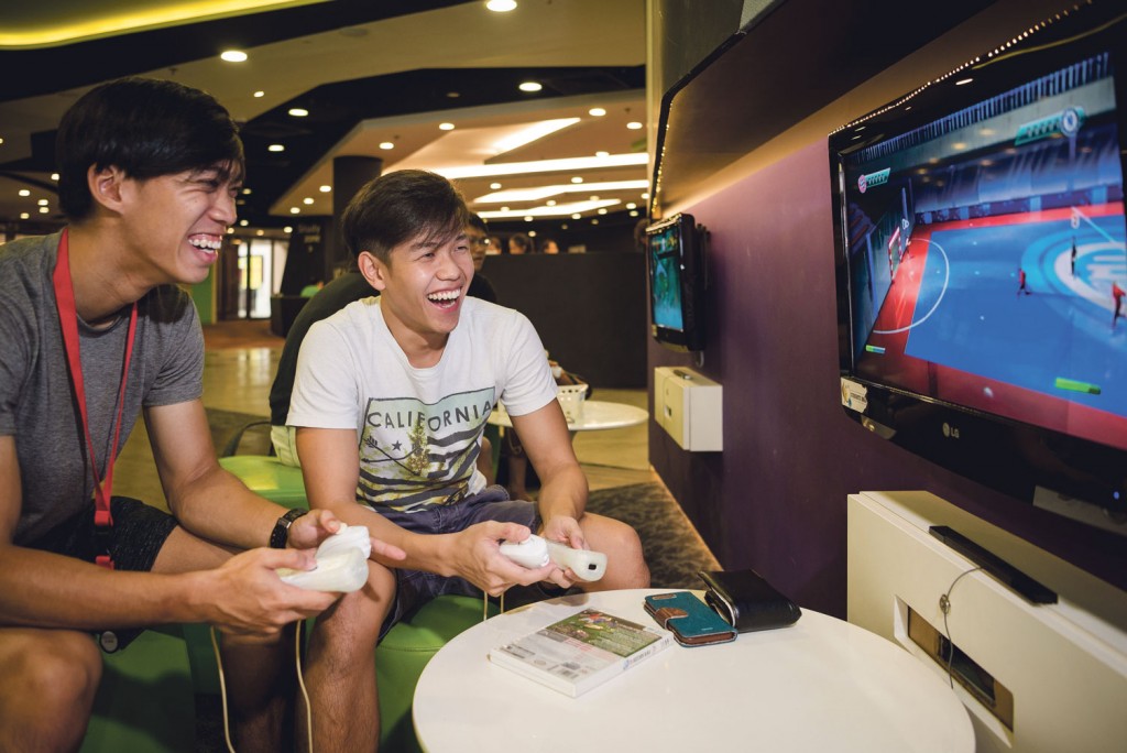 NTU students Xavier Chua (left) and Melvin Tan (right) play console games at the Student Activities Centre. PHOTOS: ZHENG JUNCEN
