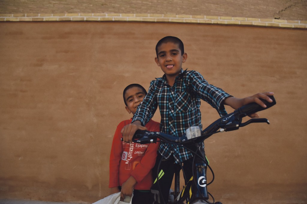 YOUTHFUL SPIRIT: Two boys indulge in some fun outside the Jame Mosque in Yazd. Iran’s youth makes up the majority of its people, with two-thirds of the population under 35. 