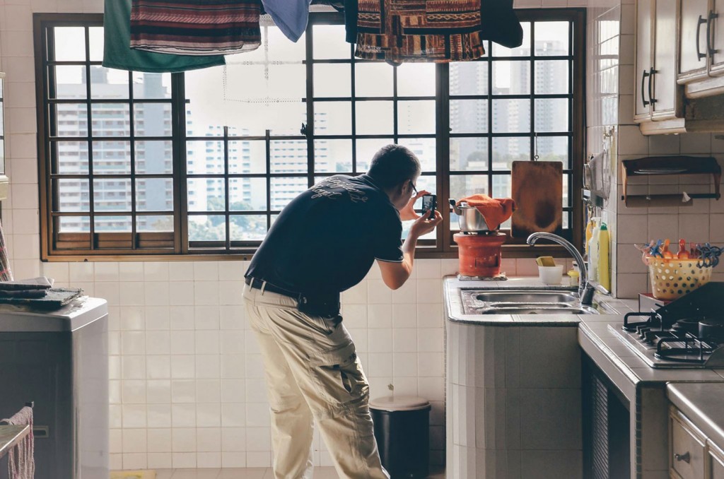 With their impending move, a lot of old furniture will be replaced with new pieces. New sofas, a curved TV and even an all-new, king-sized bed await them at their new apartment in Kallang. Here, son-in-law Mr Seah Kam Chuan, 50, takes a photo for memory’s sake and to seek inspiration for his own art pieces.