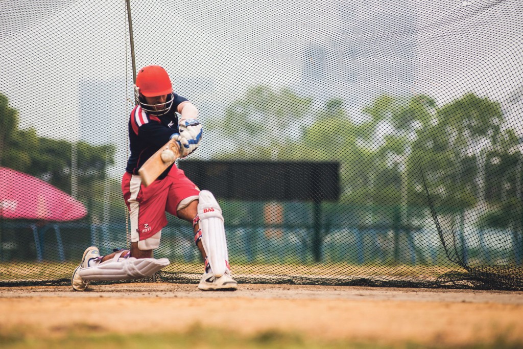 BATTING AWAY: Mr Arjun’s turn to take the bat. Even with a full-time job, he manages to join in the national team’s training sessions on Thursday and Saturday evenings, as well as coach the NTU team on Wednesday nights. “If I’m spending so much time on cricket, I want the best shot at succeeding,” said Mr Arjun.