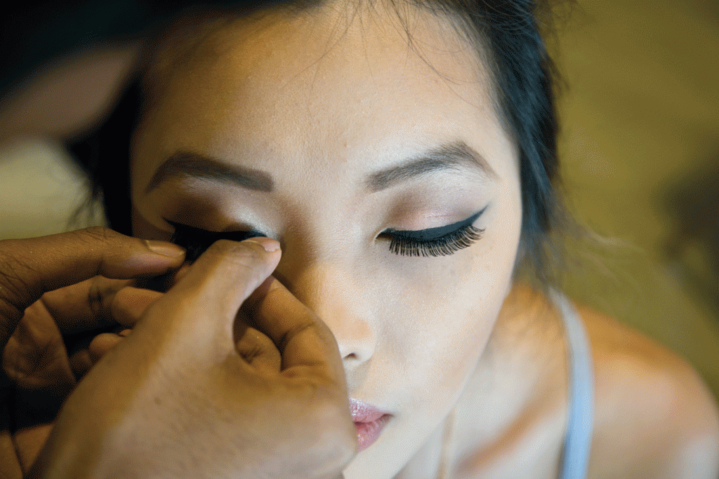 Melissa Low, a previous student of the Technology Art in Fashion module, spices up her eye makeup with a pair of fake lashes.