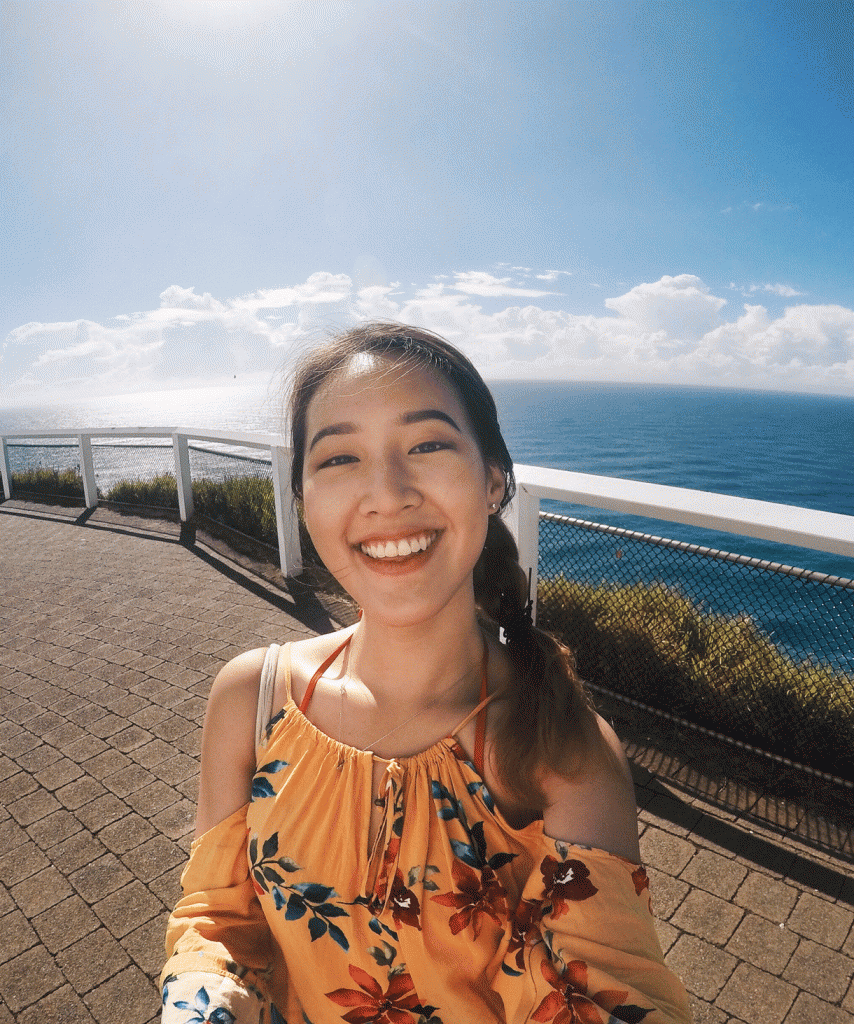 Hui En at the lighthouse of her favourite beach, Cape Byron, for a scenic view